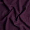 Midweight Linen Swatch | Fig | A close up of midweight linen fabric in fig, a richly saturated purple-garnet.