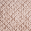 Silk Velvet Quilted Throw Pillow | Pearl | A close up of quilted silk velvet fabric in pearl, a nude-like, soft rose pink tone.