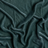 Loulah Sham | Eucalyptus | A close up of silk velvet fabric in eucalyptus, a soft light green.