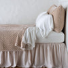 Pearl | Silk velvet quilted coverlet with matching shams and white sheeting - pearl, side view.