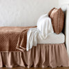 Silk Velvet Quilted Coverlet | Rouge | coverlet with matching shams and white sheeting - side view.