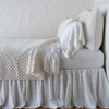 Silk Velvet Quilted Coverlet | Winter White | coverlet with matching shams and white sheeting - side view.