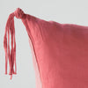Taline Throw Pillow | Poppy | Corner detail close-up of Taline pillow, highlighting hand-tied charmeuse tassel detail - poppy.