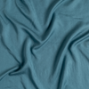 Madera Luxe Twin Flat Sheet | Cenote | A close up of tencel™ fabric in cenote, a vibrant, ocean-inspired blue-green.