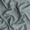 Madera Luxe Twin Flat Sheet | Eucalyptus | A close up of tencel™ fabric in eucalyptus, a soft light green.