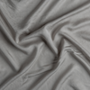 Madera Luxe Twin Duvet Cover | Fog | A close up of tencel™ fabric in fog, a neutral-warm, soft mid-tone grey.