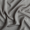 Tencel™ Swatch | Moonlight | A close up of tencel™ fabric in moonlight, a saturated, cool, mid-dark grey tone.