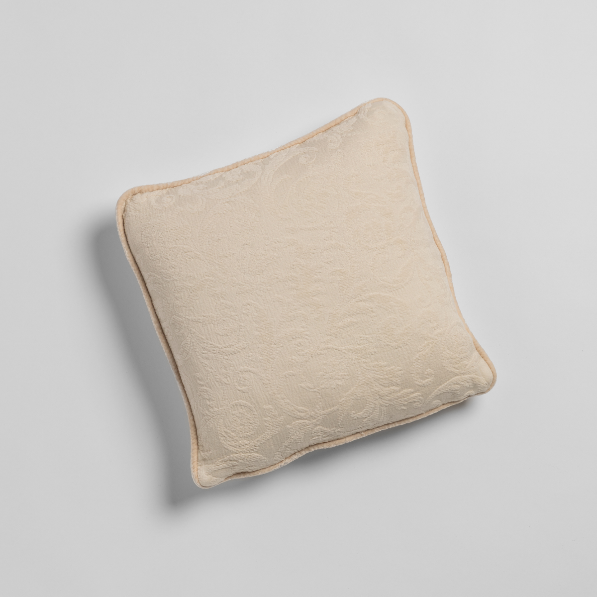 Adele Throw Pillow | Natural | organic cotton damask 18" square throw pillow against a plain background.