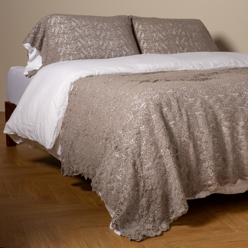 Allora Bed Scarf | Fog | cotton lace bed scarf draped across the foot of a bed dressed in linen sheets and duvet cover in winter white -  shown with matching lace pillowcase covers over a linen liner in winter white.