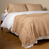 Allora Bed Scarf | Honeycomb | cotton lace bed scarf draped across the foot of a bed dressed in linen sheets and duvet cover in winter white -  shown with matching lace pillowcase covers over a linen liner in winter white.