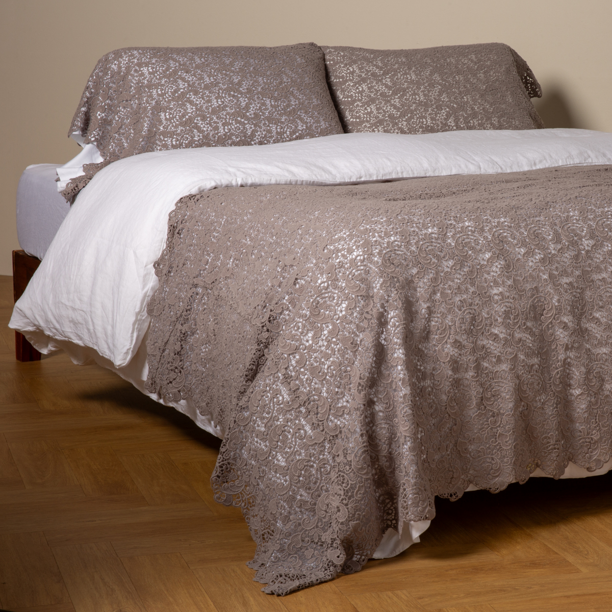 Allora Bed Scarf | Moonlight | cotton lace bed scarf draped across the foot of a bed dressed in linen sheets and duvet cover in winter white -  shown with matching lace pillowcase covers over a linen liner in winter white.