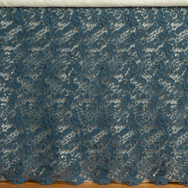 Allora Bed Skirt | Midnight | a close up of a cotton lace bed skirt layered over a winter white bed skirt - shot straight at the bed skirt.