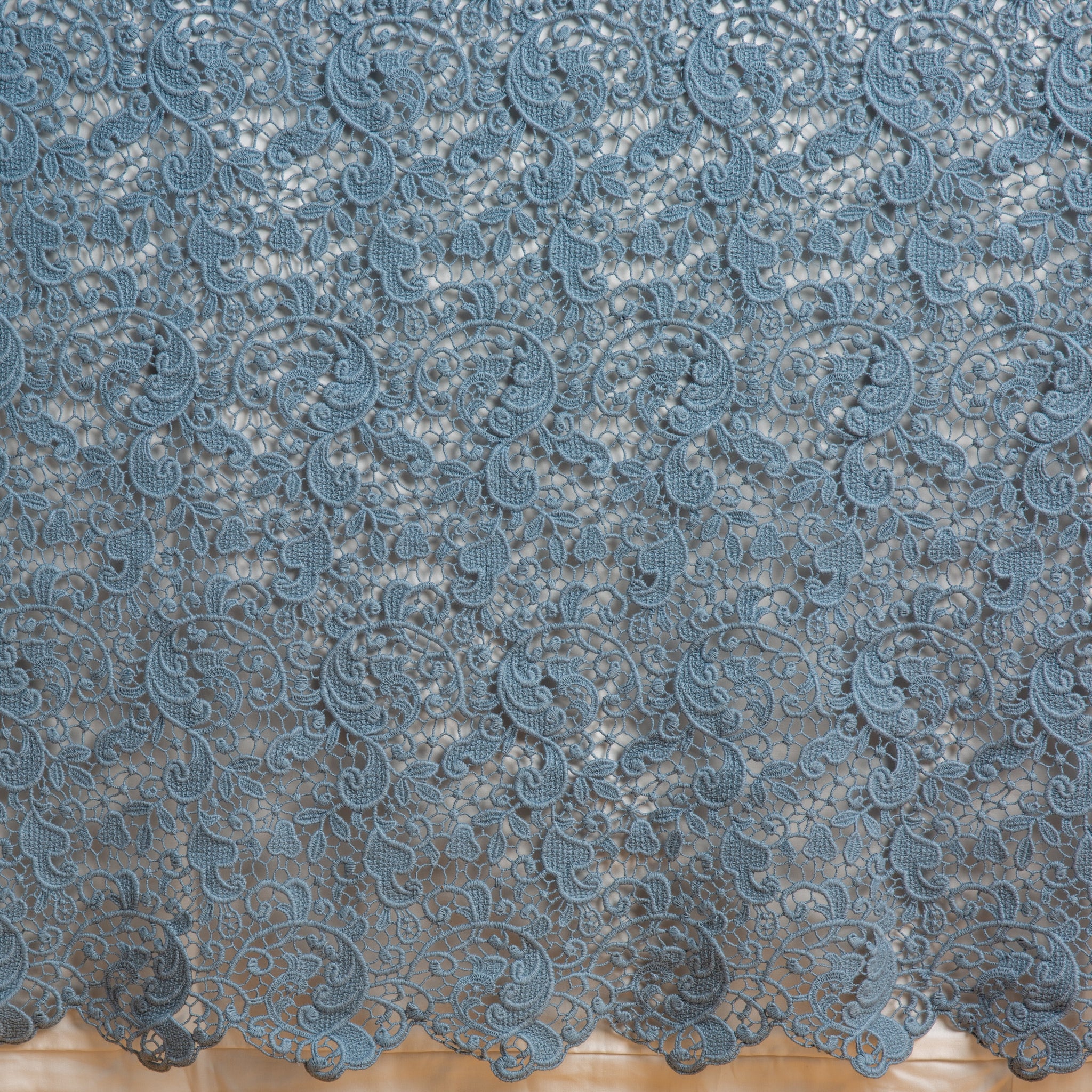 Allora Bed Skirt | Tahoe Blue | a close up of a cotton lace bed skirt layered over a winter white bed skirt - shot straight at the bed skirt.