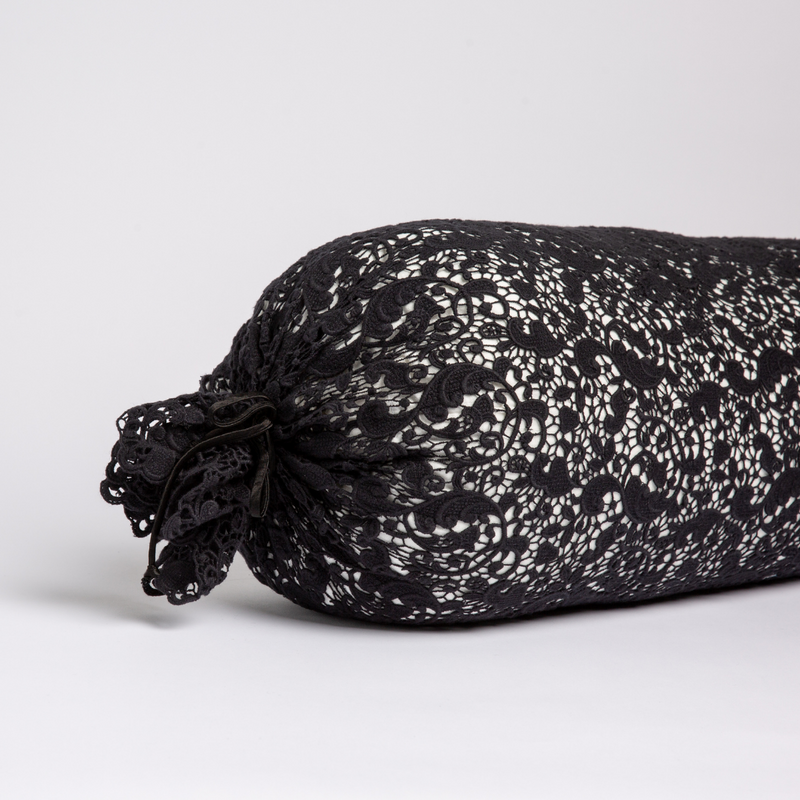 Allora Lace Throw Pillow | Corvino | one end of a lace boslter cover on a winter white liner against a white background.