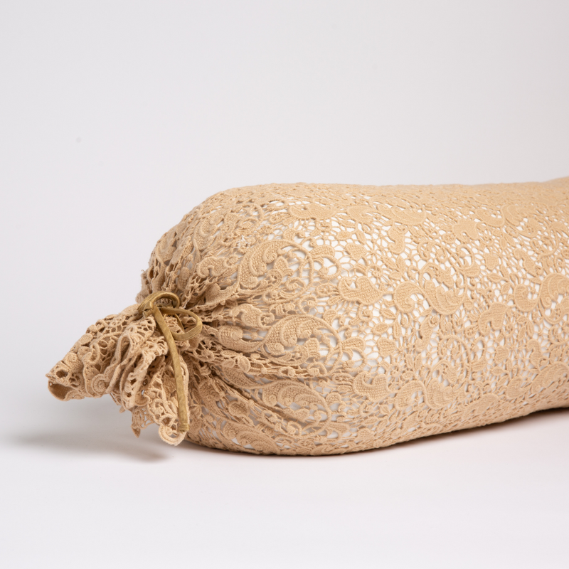 Allora Lace Throw Pillow | Honeycomb | one end of a lace boslter cover on a winter white liner against a white background.