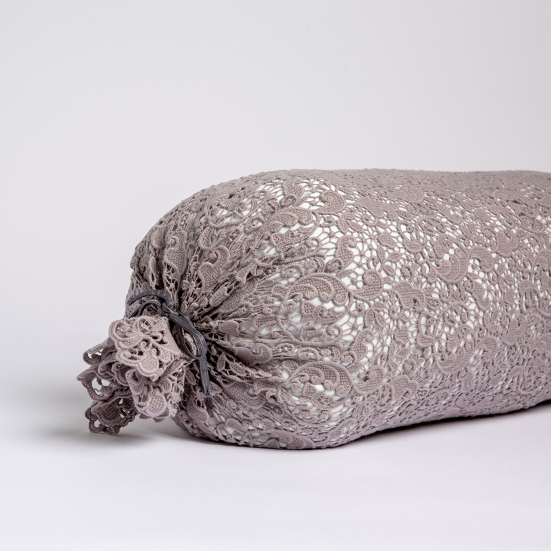 Allora Lace Throw Pillow | Moonlight | one end of a lace boslter cover on a winter white liner against a white background.