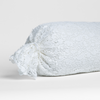 Allora Lace Throw Pillow | White | one end of a lace boslter cover on a winter white liner against a white background.