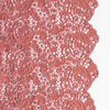 Allora Bed Scarf | Poppy | a close up of cotton all-over lace with a scalloped edge.