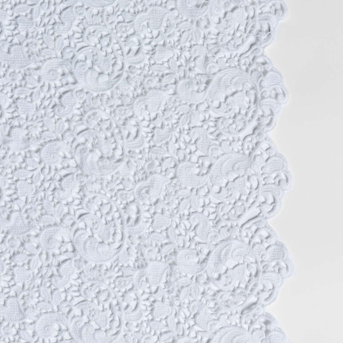Allora Bed Scarf | White | a close up of cotton all-over lace with a scalloped edge.