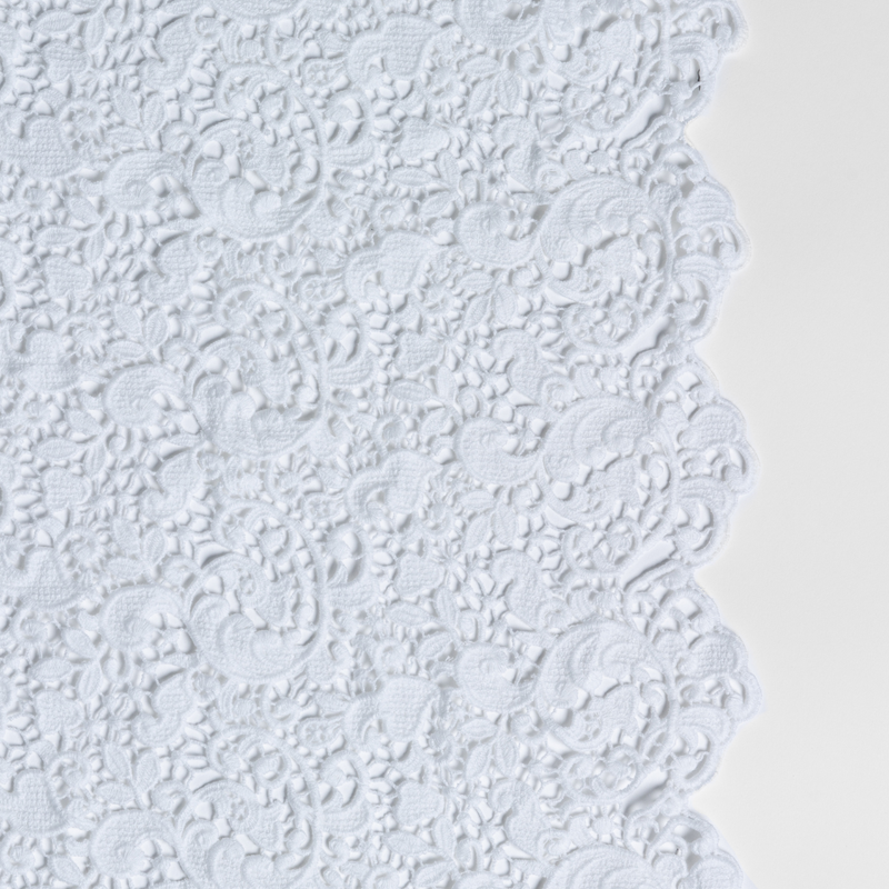 Allora Lace Throw Pillow | White | a close-up of cotton all-over lace with a scalloped edge.