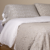 Allora Lace Pillowcase (Single) | Cloud | a pair of cotton lace pillowcase covers on winter white liners shown on a bed dressed in winter white linen with a matching cotton lace bed scarf.