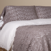 Allora Lace Pillowcase (Single) | French Lavender | a pair of cotton lace pillowcase covers on winter white liners shown on a bed dressed in winter white linen with a matching cotton lace bed scarf.