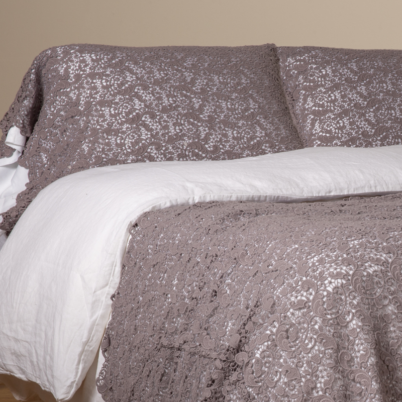 Allora Lace Pillowcase (Single) | French Lavender | a pair of cotton lace pillowcase covers on winter white liners shown on a bed dressed in winter white linen with a matching cotton lace bed scarf.