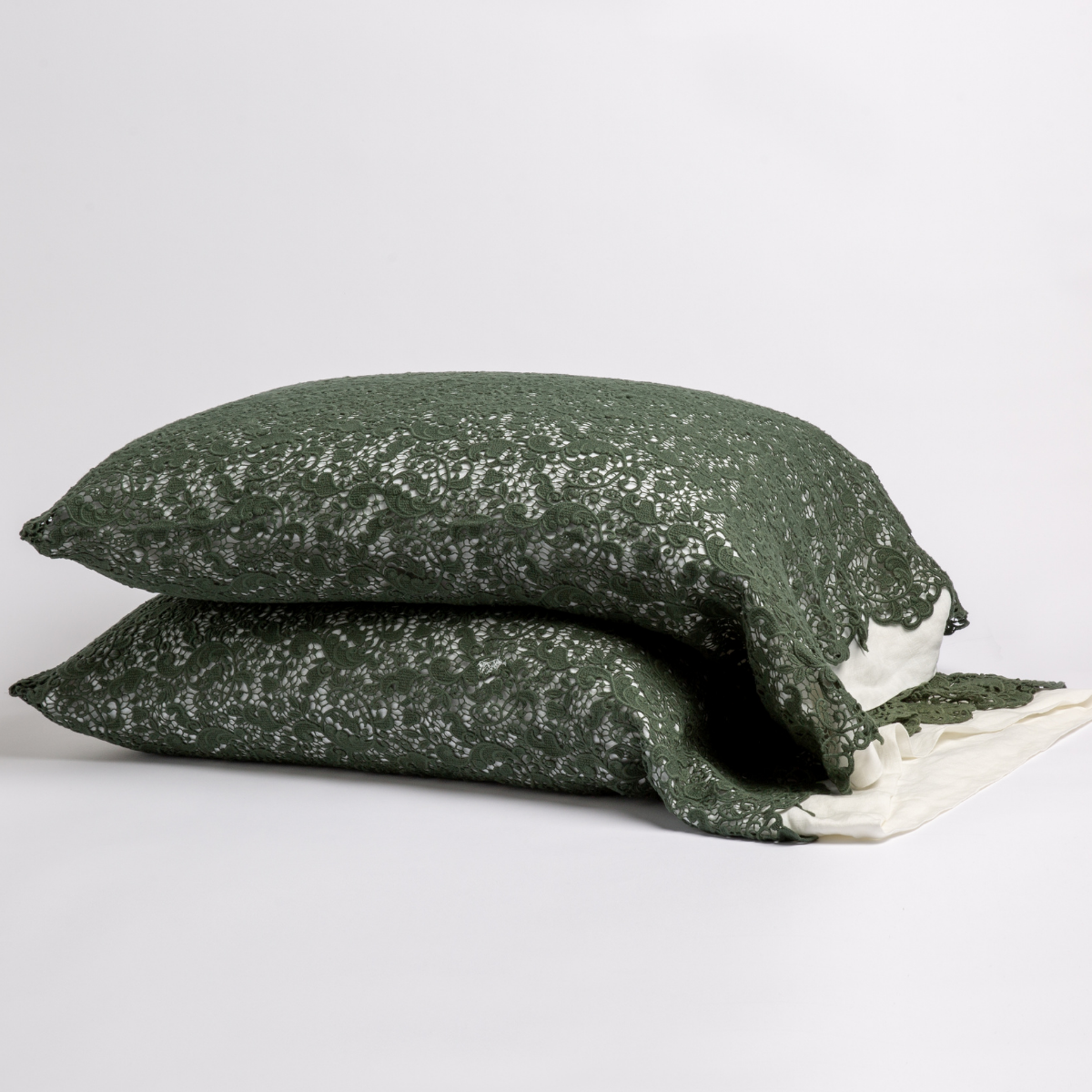 Allora Lace Pillowcase (Single) | Juniper | a pair of stacked cotton lace pillowcase covers on winter white liners against a white background.