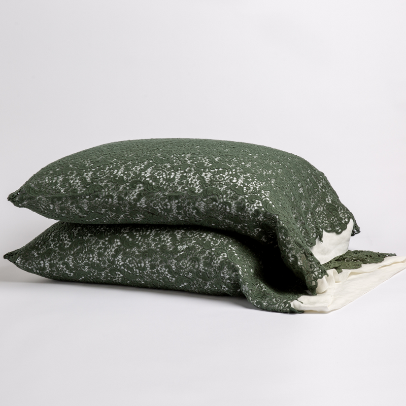 Allora Lace Pillowcase (Single) | Juniper | a pair of stacked cotton lace pillowcase covers on winter white liners against a white background.