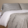 Allora Lace Pillowcase (Single) | Mineral | a pair of cotton lace pillowcase covers on winter white liners shown on a bed dressed in winter white linen with a matching cotton lace bed scarf.