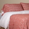 Allora Lace Pillowcase (Single) | Poppy | a pair of cotton lace pillowcase covers on winter white liners shown on a bed dressed in winter white linen with a matching cotton lace bed scarf.