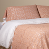 Allora Lace Pillowcase (Single) | Rouge | a pair of cotton lace pillowcase covers on winter white liners shown on a bed dressed in winter white linen with a matching cotton lace bed scarf.