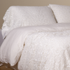 Allora Lace Pillowcase (Single) | White | a pair of cotton lace pillowcase covers on winter white liners shown on a bed dressed in winter white linen with a matching cotton lace bed scarf.