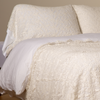 Allora Lace Pillowcase (Single) | Winter White | a pair of cotton lace pillowcase covers on winter white liners shown on a bed dressed in winter white linen with a matching cotton lace bed scarf.