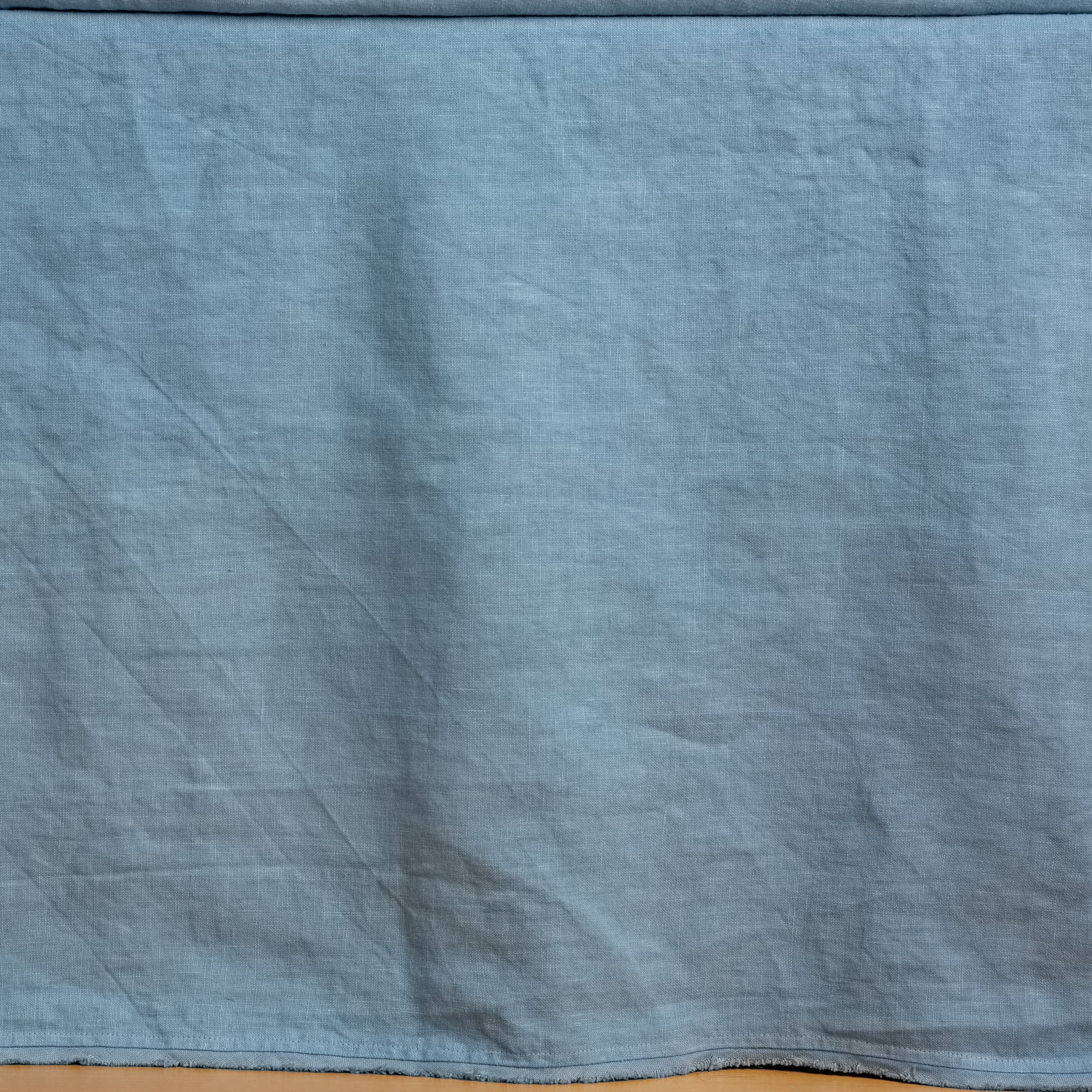 Tahoe Blue | Close up of the Austin bed skirt in tahoe blue, highlighting its tailored, ungathered style.