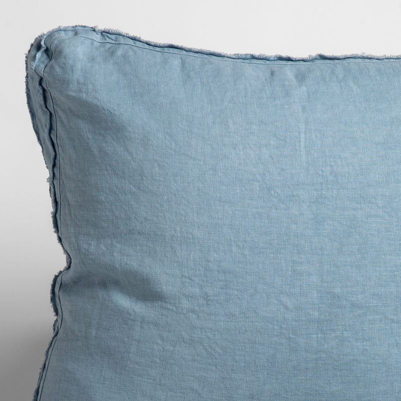 Austin Throw Pillow | Tahoe Blue | close up of midweight linen pillow corner with raw edges trimming its gusset.