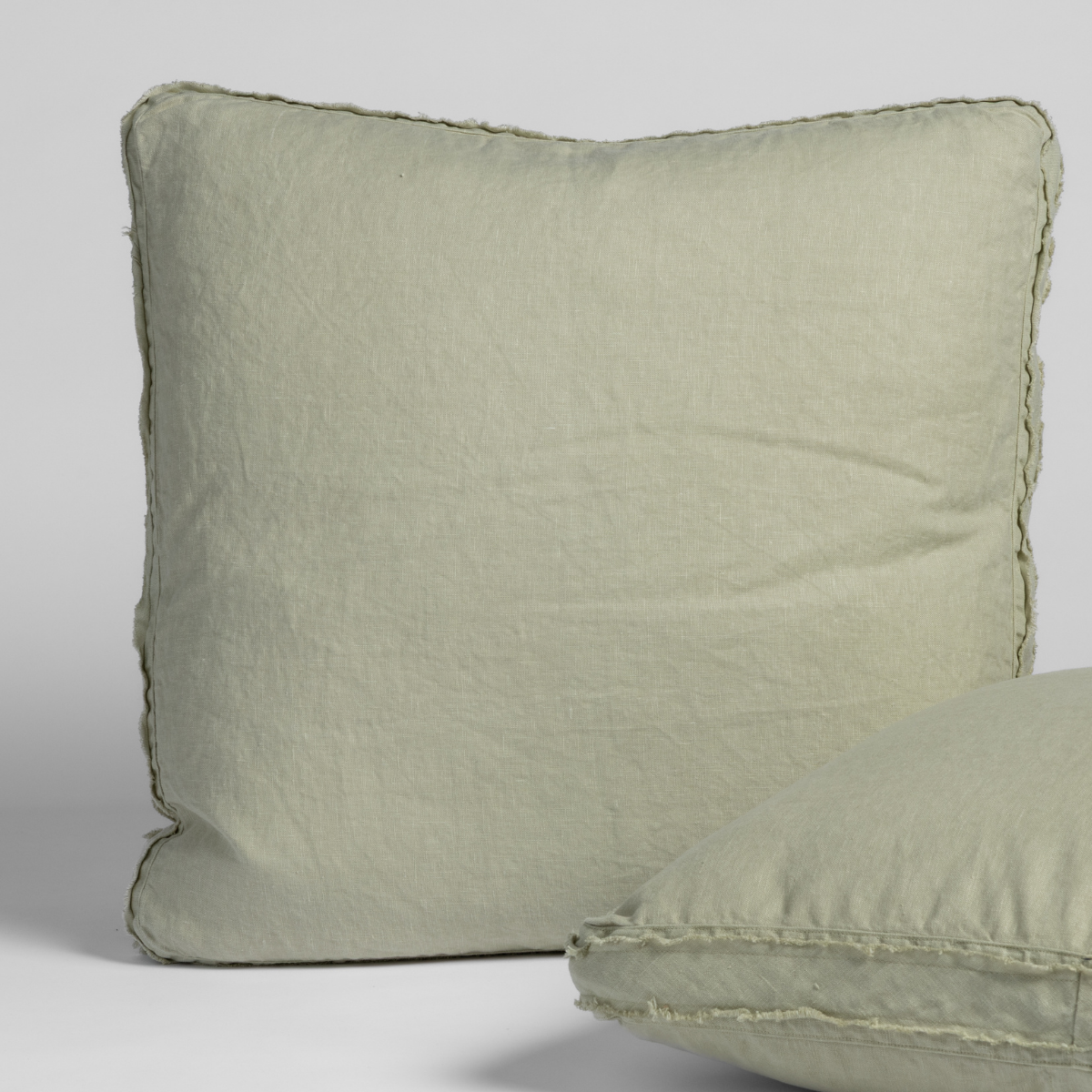 Austin Sham | Desert Sage | matching shams in desert sage, a serenely elegant green, offering a hushed hue, shown against a plain background.
