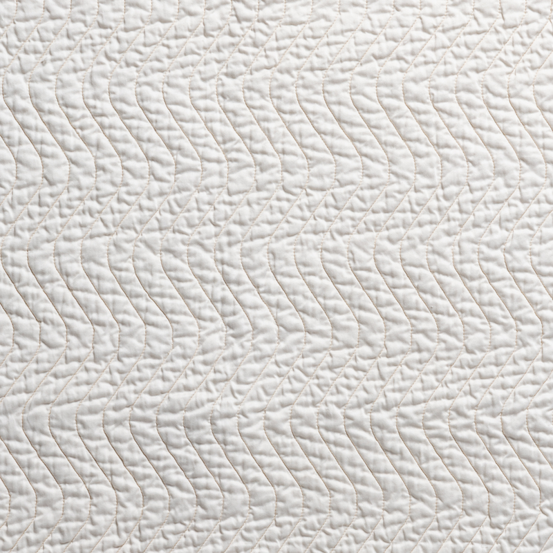 Cirillo Blanket | Natural | a closeup of cirillo quilted cotton sateen in natural, a warm neutral.