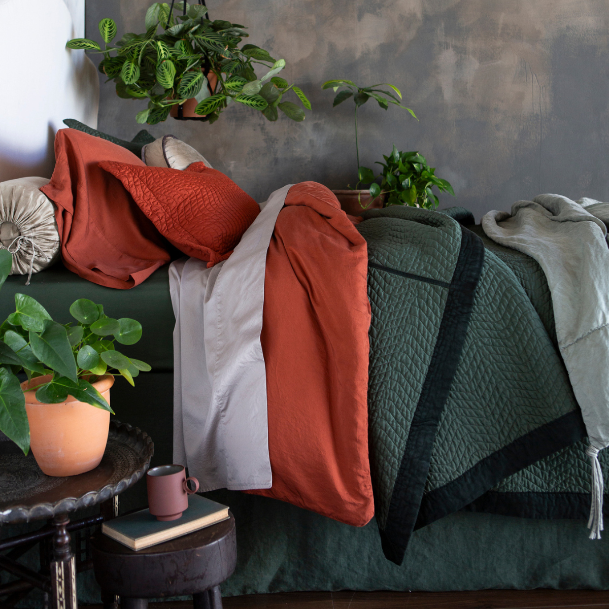 Madera Luxe Duvet Cover | a tencel duvet cover with cotton sateen sheets and quilted coverlet in bold rust and green tones.