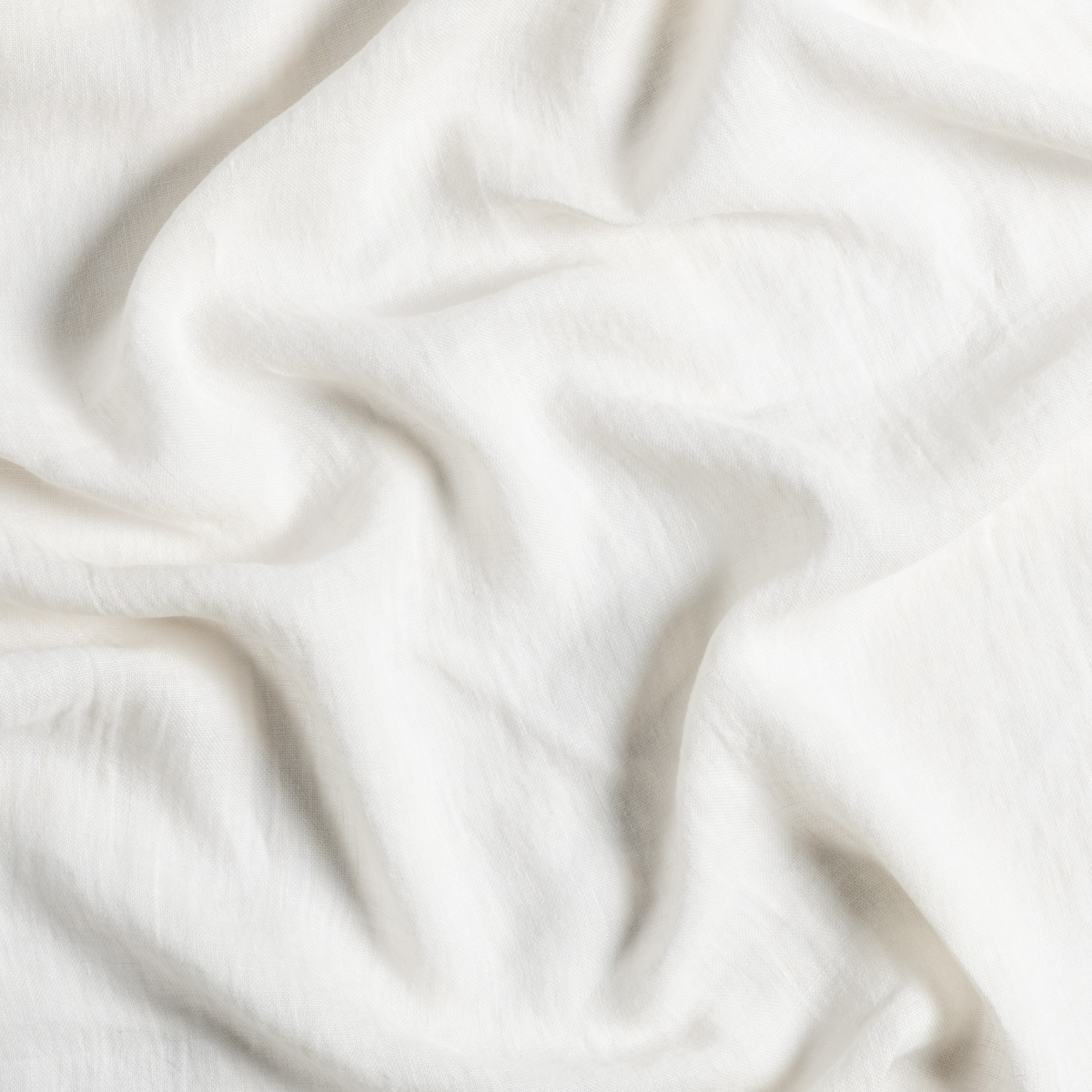 Linen Whisper Pillowcase (Single) | Natural | a close up of gently swirled linen whisper fabric in natural, a warm neutral.