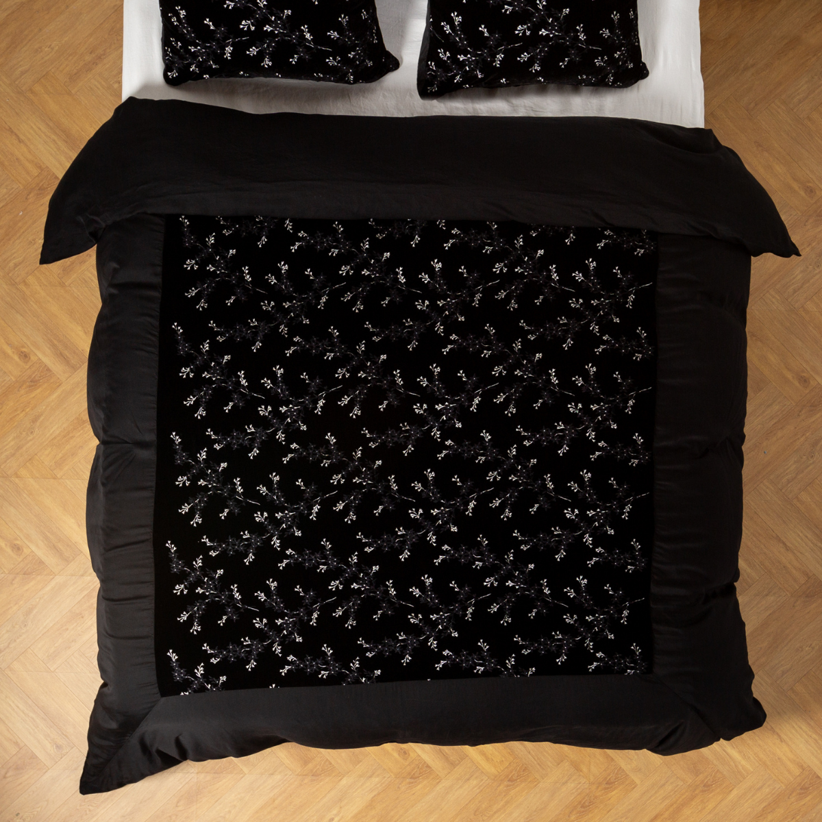 Lynette Luxe Duvet Cover | Corvino | An overhead shot of an embroidered silk velvet and tencel duvet cover and matching shams.