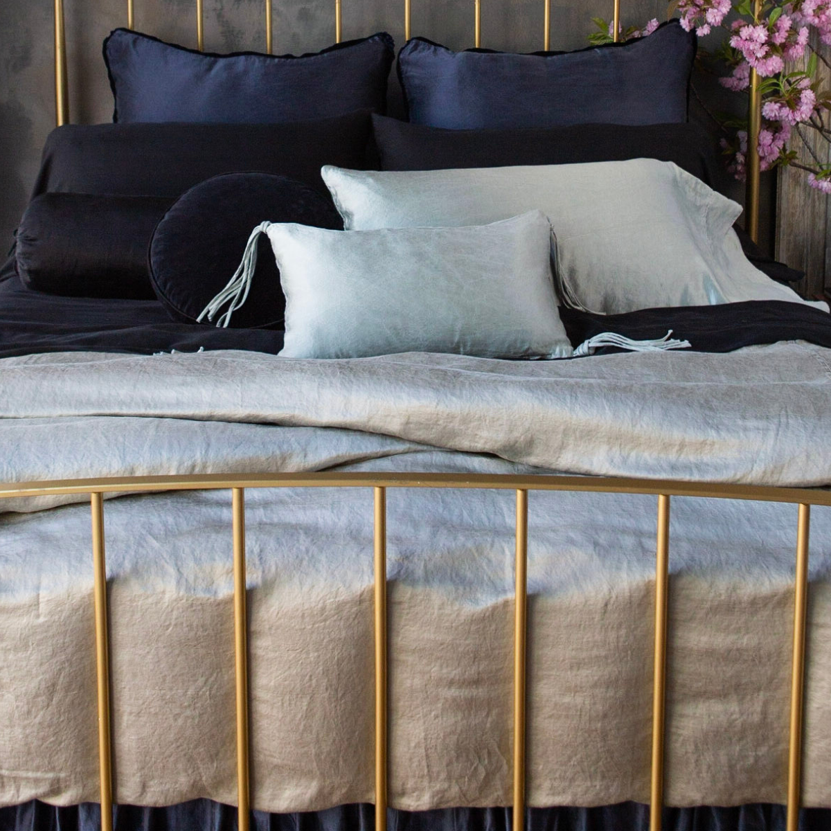 Paloma Duvet Cover | shown from the foot of the bed, a bed dressed in silk linen charmeuse from our paloma collection.