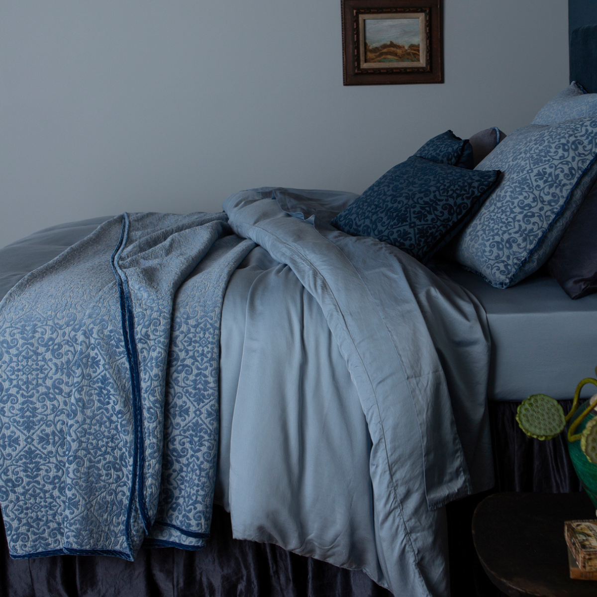 Vienna Twin Coverlet | side view of a monochromatic bed in blue tones with texture provided by the chenille pattern woven into the Vienna collection.