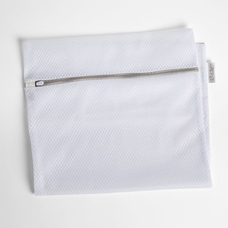 Mesh laundry bag shown folded in half and shown flat against a white background.