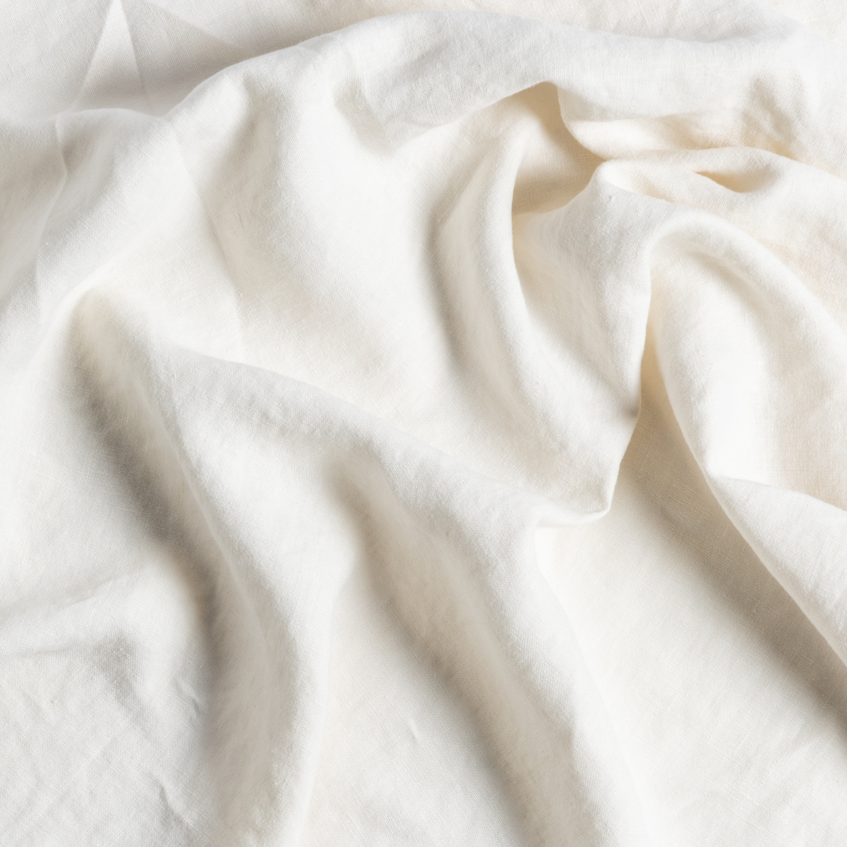 Austin Guest Towel | Natural | a close up of gently swirled midweight linen in natural, a warm neutral.