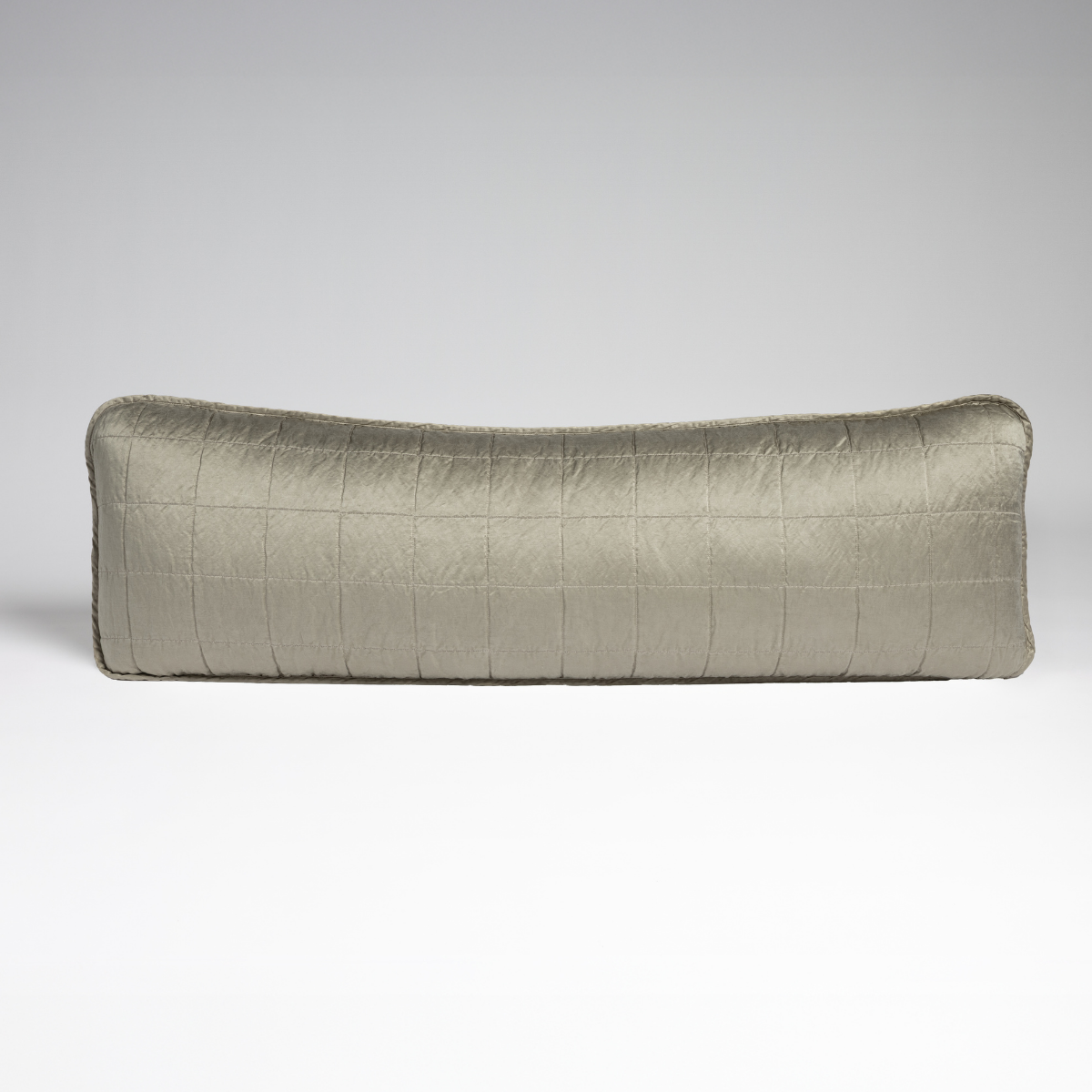Sel Throw Pillow | Fog | An overhead shot of a square-quilted rectangle throw pillow in fog, a soft mid-tone grey, against a white background.