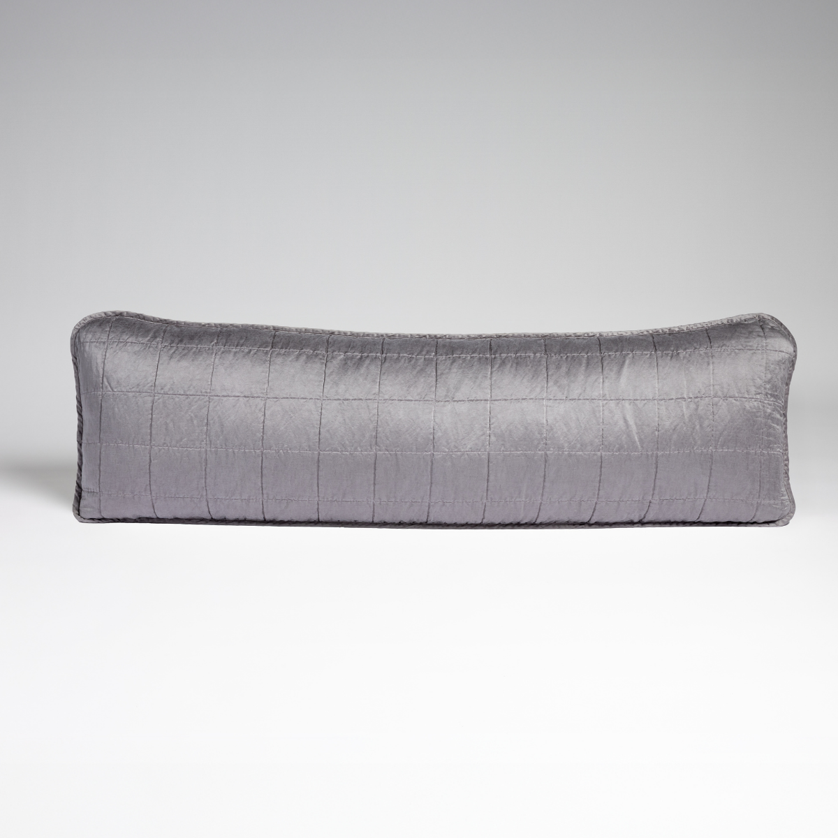 Sel Throw Pillow | French Lavender | A straight-on shot of a square-quilted body pillow in french lavender, a neutral violet tone, against a white background.