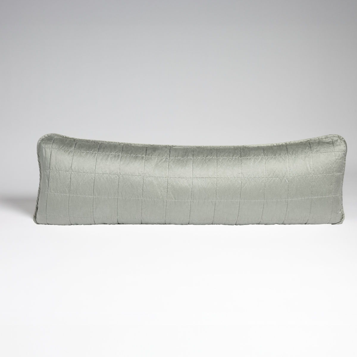 Sel Throw Pillow | Mineral | A straight-on shot of a square-quilted body pillow in mineral, a soothing seafoam blue with subtle grey-green undertones, against a white background.