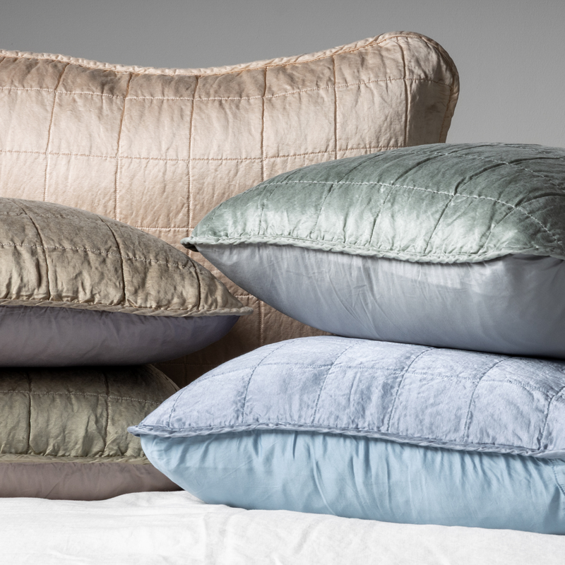 Sel Sham | A cluster shot of five charmeuse shams showing their square quilt patterned fronts and unquilted backs.