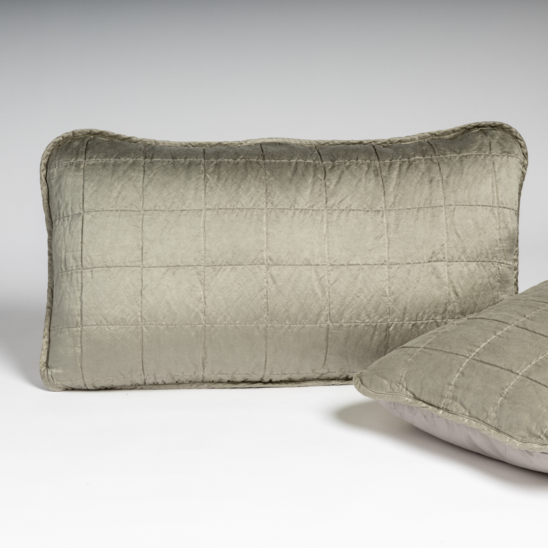 Sel Sham | Fog | A pair of shams shown in fog, a soft mid-tone grey, against a white background with one sham upright and the other on its side to show the cotton sateen back and square-quilted charmeuse front.